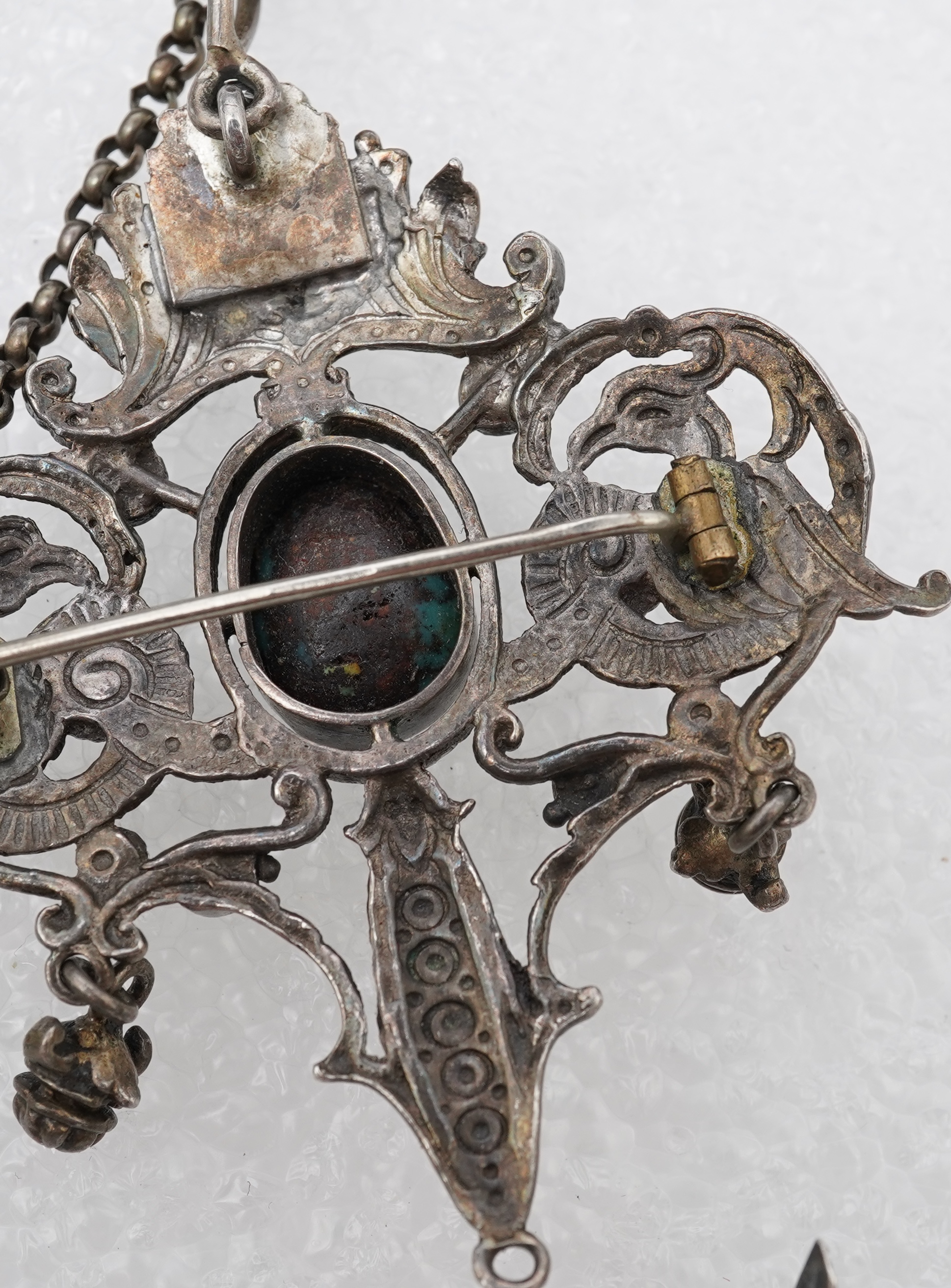 A group of jewels, comprising: a late 19th century and later Renaissance revival-style pendant set with an oval turquoise cabochon, circular-cut garnets and circular-cut green chalcedony, mounted in silver, length 6cm, s